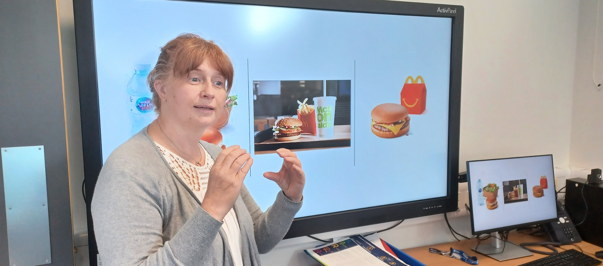 Staff member teaching deaf students